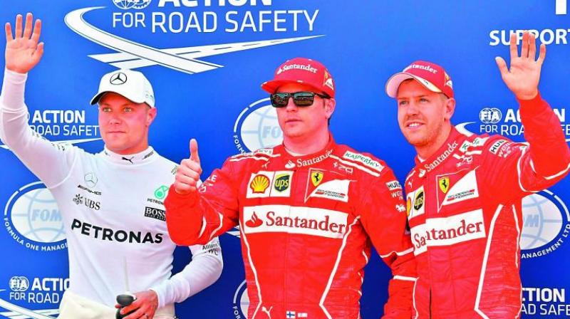 Kimi Raikkonen (centre), Sebastian Vettel (right) and Valtteri Bottas celebrate after winning the qualifying session in Monaco GP on Saturday in Monaco. (Photo: AFP) Kimi Raikkonen (centre), Sebastian Vettel (right) and Valtteri Bottas celebrate after winning the qualifying session in Monaco GP on Saturday in Monaco. (Photo: AFP)