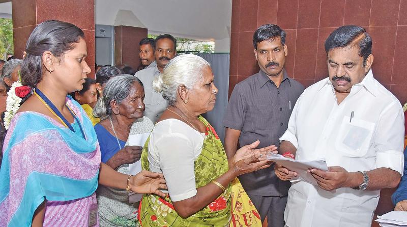 Chief Minister Edappadi K. Palanisami receives a petition from an elderly women at the Hasthampatti circuit house in Salem on Saturday. Chief Minister Edappadi K. Palanisami receives a petition from an elderly women at the Hasthampatti circuit house in Salem on Saturday.