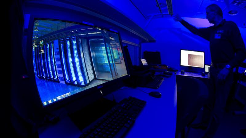 In this file photograph, a member of the Cybercrime Center turns on the light in a lab during a media tour at the occasion of the official opening of the Cybercrime Center at Europol headquarters in The Hague, Netherlands. (Photo | AP)