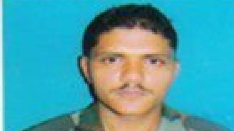 Army Jawan Sepoy Sandeep (in pic) who lost his life in Pulwama encounter earlier today. (Photo: ANI twitter) Army Jawan Sepoy Sandeep (in pic) who lost his life in Pulwama encounter earlier today. (Photo: ANI twitter)