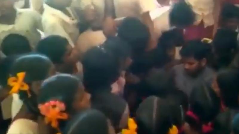 G Bhagwan was surrounded by students as they protested his transfer last week. (Photo: Screengrab/ANI) G Bhagwan was surrounded by students as they protested his transfer last week. (Photo: Screengrab/ANI)