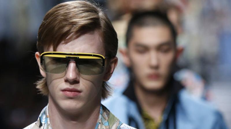 A model wears a creation part of the Prada men's Spring-Summer 2018 collection, presented in Milan, Italy, Sunday, June 18, 2017. (AP Photo/Luca Bruno) A model wears a creation part of the Prada men's Spring-Summer 2018 collection, presented in Milan, Italy, Sunday, June 18, 2017. (AP Photo/Luca Bruno)