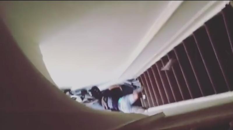 Shot from the footage showing Nkumbi lying at the bottom of the stairs. (Photo: Instagram) Shot from the footage showing Nkumbi lying at the bottom of the stairs. (Photo: Instagram)