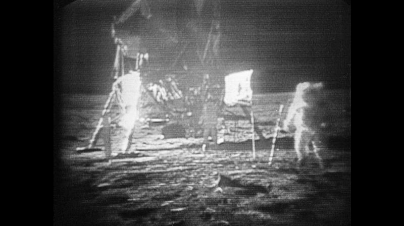 FILE - In this July 20, 1969 file photo, Apollo 11 astronaut Neil Armstrong, right, trudges across the surface of the moon leaving behind footprints. Moon dust collected by Armstrong during the first lunar landing is being sold at a New York auction. The lunar dust plus some tiny rocks that Armstrong also collected are zipped up in a small bag and are worth an estimated $2 million to $4 million. They’re just some of the items linked to space travel that Sotheby’s is auctioning off to mark the 48th anniversary of the first lunar landing on July 20. (AP Photo, File) FILE - In this July 20, 1969 file photo, Apollo 11 astronaut Neil Armstrong, right, trudges across the surface of the moon leaving behind footprints. Moon dust collected by Armstrong during the first lunar landing is being sold at a New York auction. The lunar dust plus some tiny rocks that Armstrong also collected are zipped up in a small bag and are worth an estimated $2 million to $4 million. They’re just some of the items linked to space travel that Sotheby’s is auctioning off to mark the 48th anniversary of the first lunar landing on July 20. (AP Photo, File)