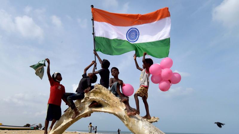 Youngsters wave the national flag (Photo: PTI) Youngsters wave the national flag (Photo: PTI)