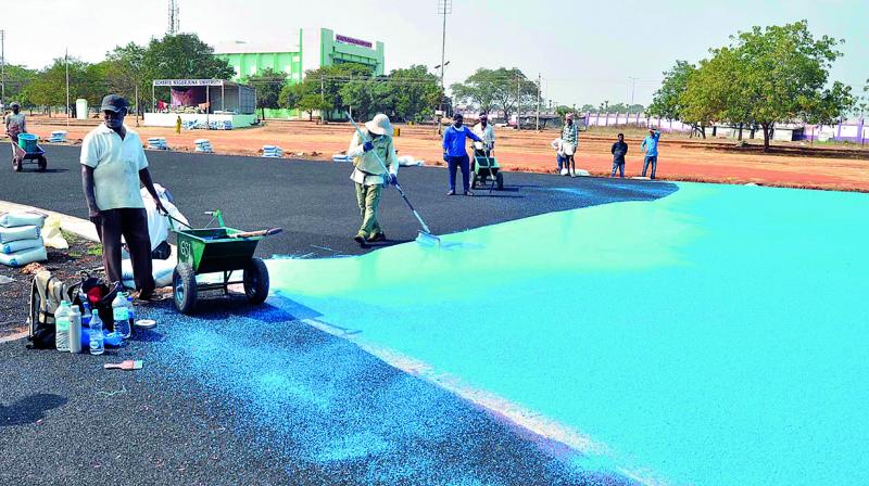 Workers lay the synthetic track in ANU premises on Tuesday. (Photo: DC) Workers lay the synthetic track in ANU premises on Tuesday. (Photo: DC)