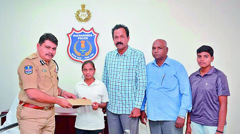 16-year-old Boddupally Anusha along with Rachakonda police commissioner Mahesh M. Bhagwat. — DC 16-year-old Boddupally Anusha along with Rachakonda police commissioner Mahesh M. Bhagwat. — DC