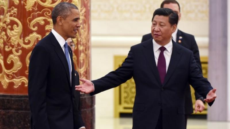 US President Barack Obama with his Chinese counterpart Xi Jinping. (Photo: AP) US President Barack Obama with his Chinese counterpart Xi Jinping. (Photo: AP)