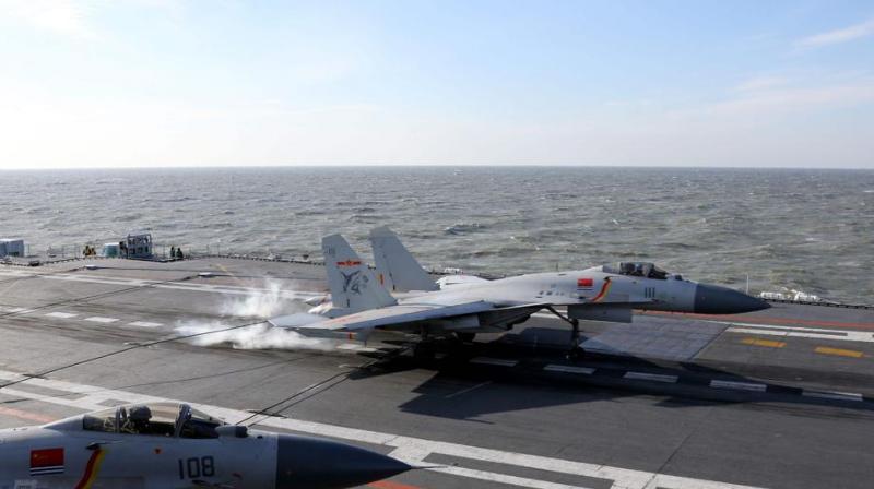 A Chinese J-15 fighter jet lands on the deck of the Liaoning aircraft carrier during military drills in the Bohai Sea, off China's northeast coast. (Photo: AFP) A Chinese J-15 fighter jet lands on the deck of the Liaoning aircraft carrier during military drills in the Bohai Sea, off China's northeast coast. (Photo: AFP)