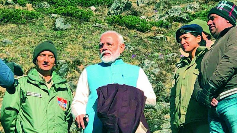 Prime Minister Narendra Modi having a word with police officials during his visit to Kedarnath. Prime Minister Narendra Modi having a word with police officials during his visit to Kedarnath.