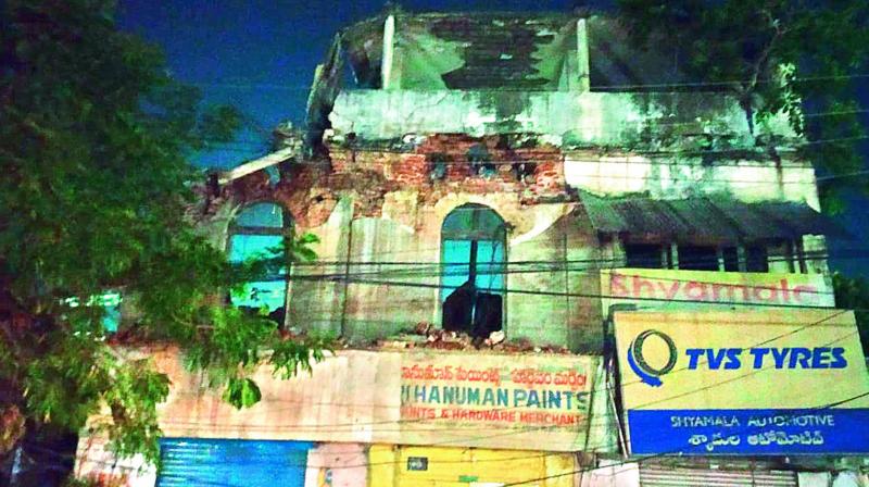 The partially demolished building in Nampally that the GHMC has not brought down completely. The partially demolished building in Nampally that the GHMC has not brought down completely.