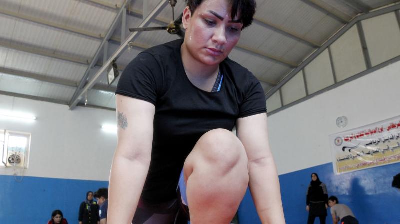Iraqi female wrestler Alia Hussein attends a training practise at a gym in Diwaniyahh, around 160 kilometres (100 miles) south of the capital Baghdad, on October 7, 2018. - Taking on a sport largely reserved for men, Iraq's first women's wrestling squad grapples in the ring but it also wrangles with strict traditions in the country's tribal south.(Photo: AFP) Iraqi female wrestler Alia Hussein attends a training practise at a gym in Diwaniyahh, around 160 kilometres (100 miles) south of the capital Baghdad, on October 7, 2018. - Taking on a sport largely reserved for men, Iraq's first women's wrestling squad grapples in the ring but it also wrangles with strict traditions in the country's tribal south.(Photo: AFP)