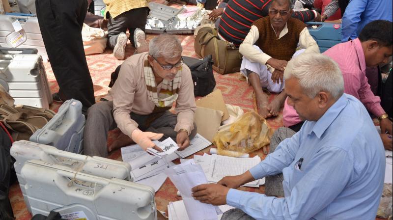 Polling officers collect election material before departing for their respective polling station from a distribution centre for 6th phase of UP Assembly elections in Gorakpur. (Photo: PTI) Polling officers collect election material before departing for their respective polling station from a distribution centre for 6th phase of UP Assembly elections in Gorakpur. (Photo: PTI)