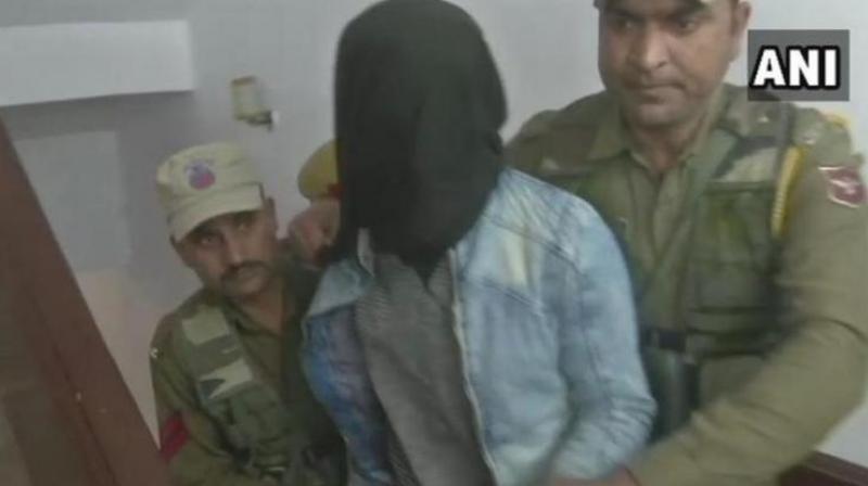 The 'juvenile' was nabbed immediately after he allegedly threw the grenade at the Jammu bus stand that left two people dead and 29 injured on March 7. (Image: ANI) The 'juvenile' was nabbed immediately after he allegedly threw the grenade at the Jammu bus stand that left two people dead and 29 injured on March 7. (Image: ANI)