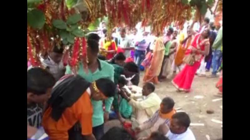 The temple is located at the top of a giant stone and devotees had to crawl to enter the temple. (Photo: ANI) The temple is located at the top of a giant stone and devotees had to crawl to enter the temple. (Photo: ANI)