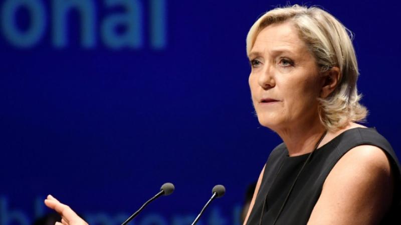 Speaking to reporters in the halls of the National Assembly, Le Pen said she felt 'persecuted' by the state and would defy the order. (Photo: AFP) Speaking to reporters in the halls of the National Assembly, Le Pen said she felt 'persecuted' by the state and would defy the order. (Photo: AFP)