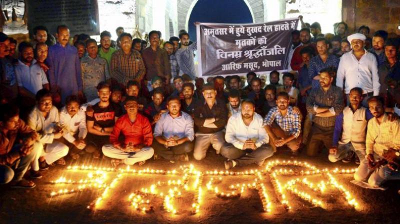 The protesters raised slogans against the district administration and vent their ire against the railways for not slowing down the train. (Photo: PTI) The protesters raised slogans against the district administration and vent their ire against the railways for not slowing down the train. (Photo: PTI)