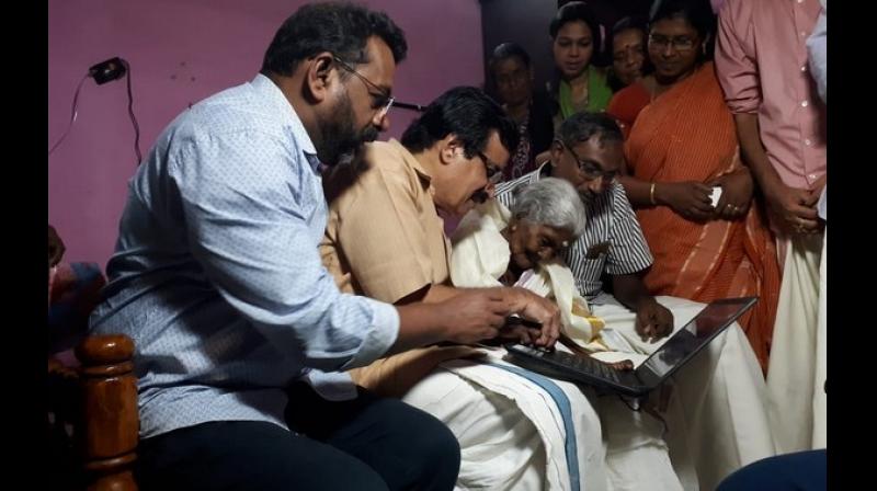 Last week, the nonagenarian had expressed her desire to learn computers. To fulfill this, state education minister C Raveendranath visited her home and gifted her a laptop. (Photo: ANI) Last week, the nonagenarian had expressed her desire to learn computers. To fulfill this, state education minister C Raveendranath visited her home and gifted her a laptop. (Photo: ANI)