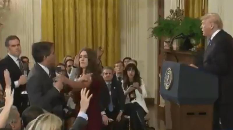 Frame-by-frame comparison with an AP video of same incident shows the one tweeted by Sanders appears to have been altered to speed up Acosta’s arm movement as he touches the intern’s arm, says Abba Shapiro, an independent video producer. (Photo: Twitter Screengrab | @PressSec) Frame-by-frame comparison with an AP video of same incident shows the one tweeted by Sanders appears to have been altered to speed up Acosta’s arm movement as he touches the intern’s arm, says Abba Shapiro, an independent video producer. (Photo: Twitter Screengrab | @PressSec)