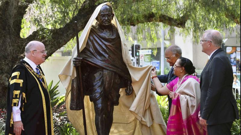 President Ram Nath Kovind and First Lady Savita Kovind unveil a statue of Mahatma Gandhi at Jubilee Park in the town of Parramatta, in Sydney on Thursday, November 22, 2018. Mayor of Parramatta, Andrew Wilson, and Australian Prime Minister Scott Morrison are also seen. (Photo: PTI) President Ram Nath Kovind and First Lady Savita Kovind unveil a statue of Mahatma Gandhi at Jubilee Park in the town of Parramatta, in Sydney on Thursday, November 22, 2018. Mayor of Parramatta, Andrew Wilson, and Australian Prime Minister Scott Morrison are also seen. (Photo: PTI)