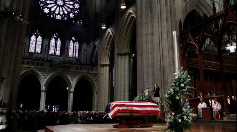 George W Bush delivers a eulogy beside the flag-draped casket of his father George HW Bush, during his state funeral at Washington National Cathedral. (Photo: AFP) George W Bush delivers a eulogy beside the flag-draped casket of his father George HW Bush, during his state funeral at Washington National Cathedral. (Photo: AFP)