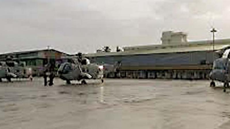 Initial reports had said the two were killed when the hangar collapsed on them. Initial reports had said the two were killed when the hangar collapsed on them.
