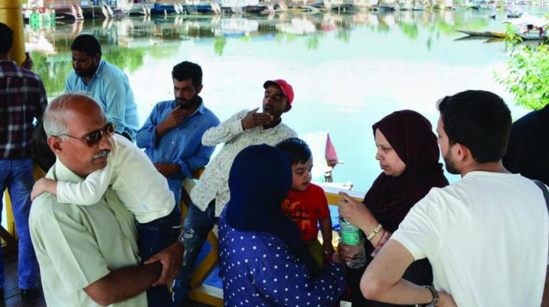 Tourists and Amarnath Yatris leave from the valley after government issued security advisory to curtail stay in Kashmir in Srinagar on Saturday. (Photo: PTI) Tourists and Amarnath Yatris leave from the valley after government issued security advisory to curtail stay in Kashmir in Srinagar on Saturday. (Photo: PTI)