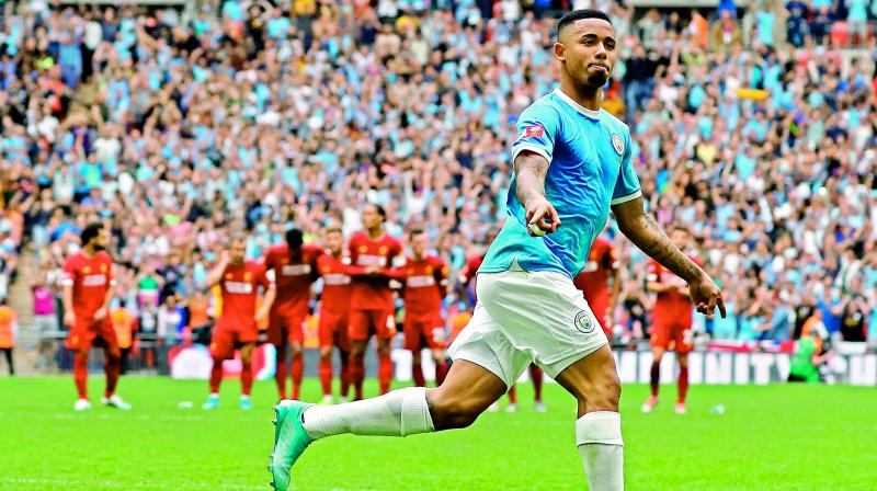 Manchester City’s Brazilian striker Gabriel Jesus celebrates after converting the winning penalty in the shoot-out of the English Community Shield football match at Wembley Stadium in London on Sunday. (AFP) Manchester City’s Brazilian striker Gabriel Jesus celebrates after converting the winning penalty in the shoot-out of the English Community Shield football match at Wembley Stadium in London on Sunday. (AFP)
