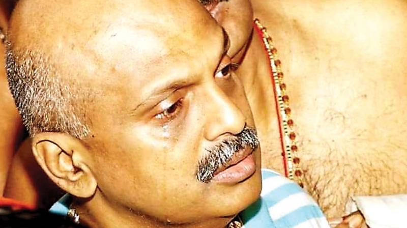 IG S. Sreejith in tears during 'nirmalyam' at Sabarimala sannidhanam on Monday. IG S. Sreejith in tears during 'nirmalyam' at Sabarimala sannidhanam on Monday.