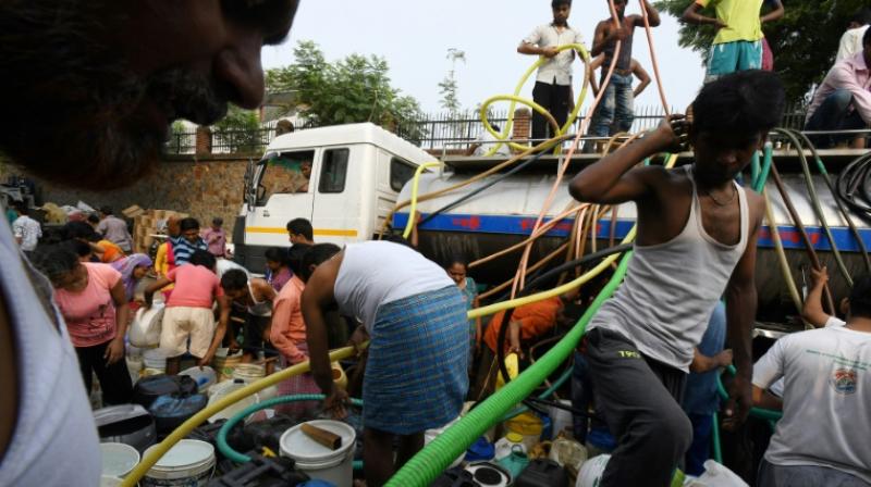For many in Delhi, the daily water run is a mad and sometimes dangerous scramble. (Photo: AFP) For many in Delhi, the daily water run is a mad and sometimes dangerous scramble. (Photo: AFP)
