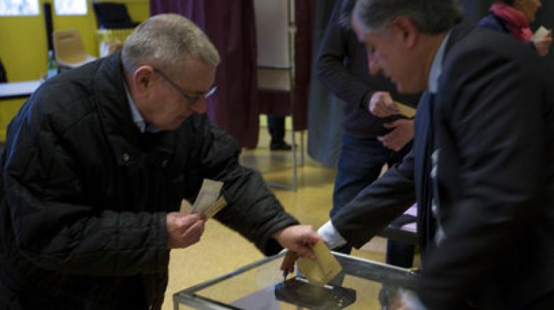 The two top rankers in Sunday's vote will face off on May 7 for the second and final round of voting. (Photo: AP) The two top rankers in Sunday's vote will face off on May 7 for the second and final round of voting. (Photo: AP)