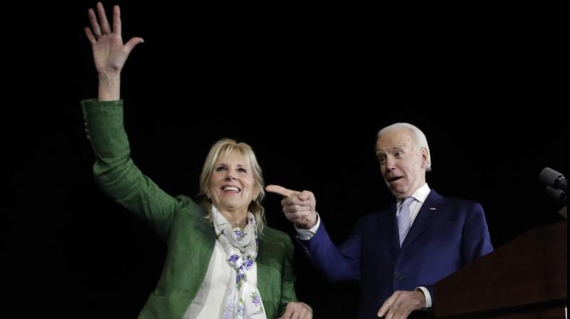 Democratic presidential candidate former Vice President Joe Biden, right, and his wife Jill attend a primary election night rally in Los Angeles.  AP photo