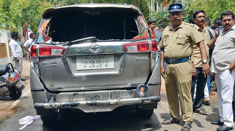 The damaged car of AMMK cadre Parimalam. (Photo:DC) The damaged car of AMMK cadre Parimalam. (Photo:DC)