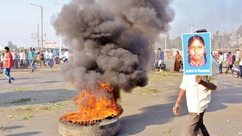 Agitators burn tyres in Kalaburagi on Thursday during the bandh against the recent rape and murder of a Dalit girl in Vijayapura – KPN Agitators burn tyres in Kalaburagi on Thursday during the bandh against the recent rape and murder of a Dalit girl in Vijayapura – KPN