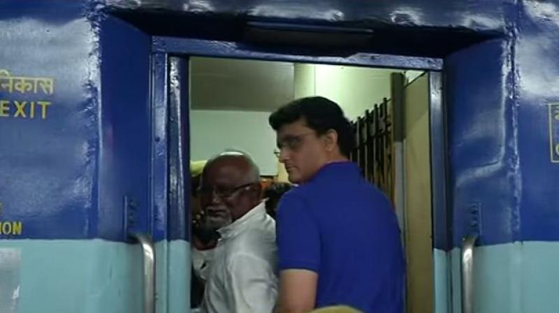 Flanked by police constables, Sourav Ganguly got into an argument with a fellow passenger about who the seat belonged to. (Photo: Screengrab/ Youtube) Flanked by police constables, Sourav Ganguly got into an argument with a fellow passenger about who the seat belonged to. (Photo: Screengrab/ Youtube)
