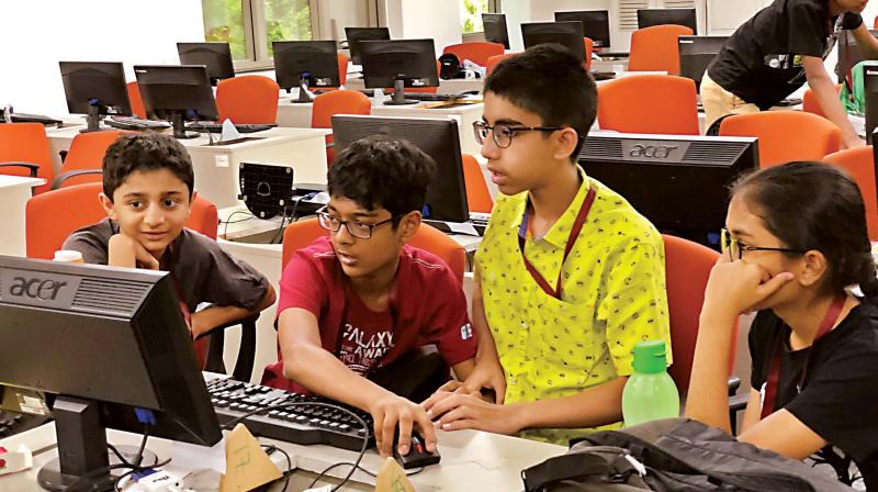 Children participating in the Spark Catch Them Young programme at Infosys campus, in Bengaluru on Friday (Photo: DC) Children participating in the Spark Catch Them Young programme at Infosys campus, in Bengaluru on Friday (Photo: DC)