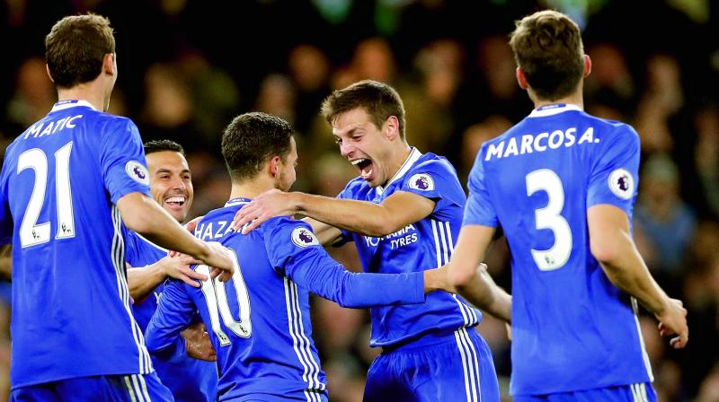 Chelsea’s Eden Hazard (third from left) celebrates with team mates after scoring against Everton at Stamford Bridge in London on Saturday. The host won 5-0. (Photo: AP) Chelsea’s Eden Hazard (third from left) celebrates with team mates after scoring against Everton at Stamford Bridge in London on Saturday. The host won 5-0. (Photo: AP)