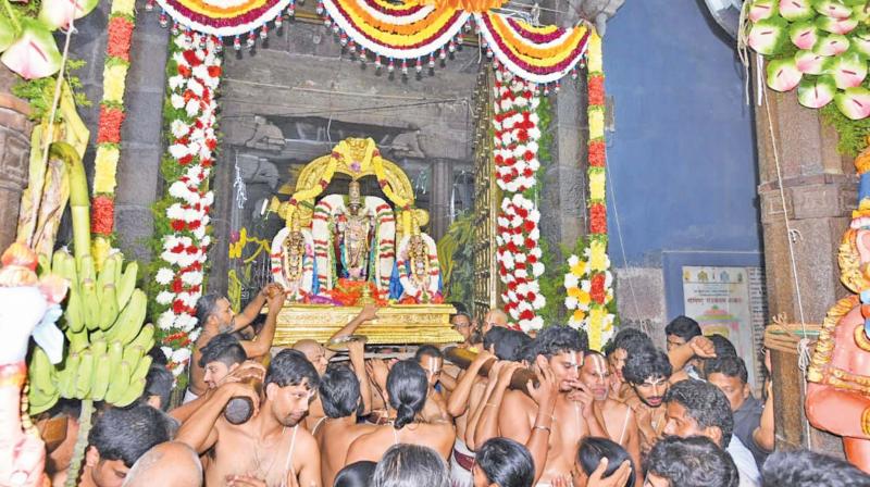 Lord Parthasarathy Swamy is being brought via the Paramapadavasal at Sri Parthasarathy Swamy temple. — DC Lord Parthasarathy Swamy is being brought via the Paramapadavasal at Sri Parthasarathy Swamy temple. — DC