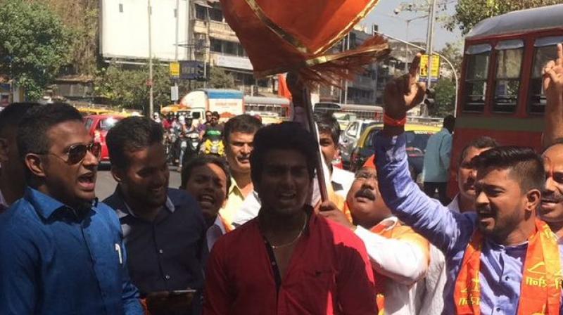 Shiv Sena workers celebrate in Mumbai as early trends suggest a victory in the BMC polls. (Photo: ANI Twitter) Shiv Sena workers celebrate in Mumbai as early trends suggest a victory in the BMC polls. (Photo: ANI Twitter)