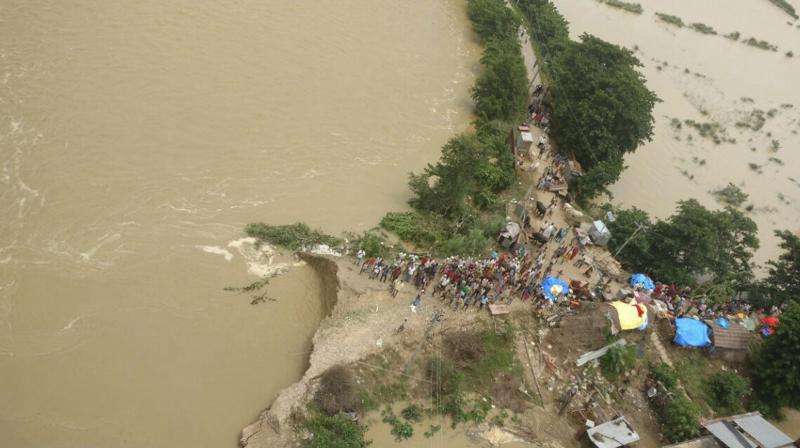 Reports reaching Lucknow said Army choppers, NDRF and PAC (flood) jawans continued relief and rescue operations in the badly hit areas. (Photo: PTI) Reports reaching Lucknow said Army choppers, NDRF and PAC (flood) jawans continued relief and rescue operations in the badly hit areas. (Photo: PTI)