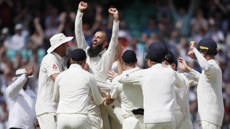 England's Moeen Ali is lifted by his team mates after he picks up hat trick against South Africa and win the test match. (Photo: AP) England's Moeen Ali is lifted by his team mates after he picks up hat trick against South Africa and win the test match. (Photo: AP)