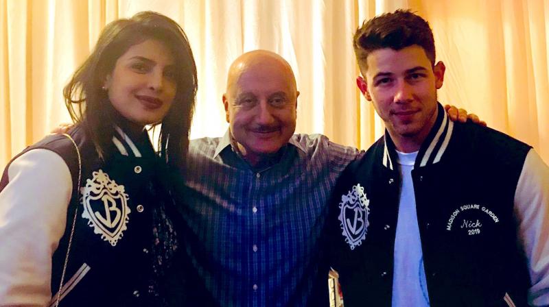 Anupam Kher with Priyanka and Nick. Anupam Kher with Priyanka and Nick.