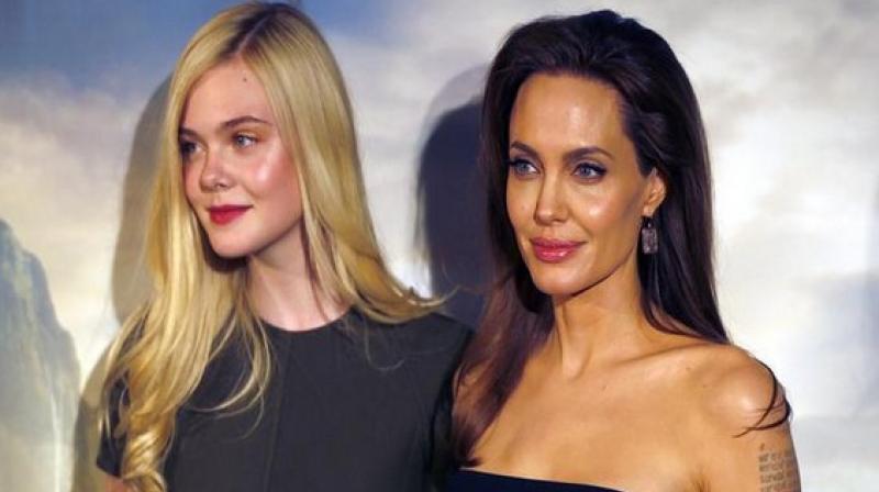Angelina Jolie and Elle Fanning. Angelina Jolie and Elle Fanning.