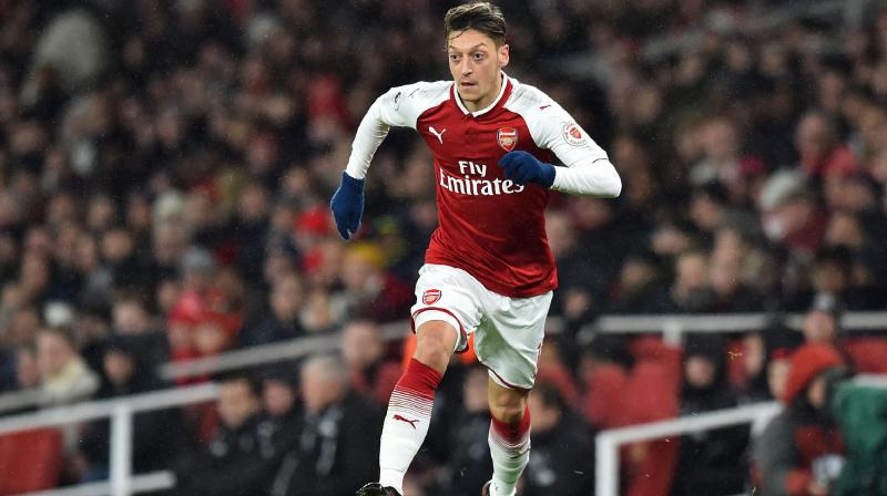 Arsenal's new head coach, Unai Emery, and players have rallied round Ozil on their pre-season tour, while the hashtags #StandWithOzil and #SayNoToRacism have been popular on social media. (Photo: AFP) Arsenal's new head coach, Unai Emery, and players have rallied round Ozil on their pre-season tour, while the hashtags #StandWithOzil and #SayNoToRacism have been popular on social media. (Photo: AFP)