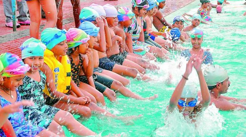 File photo of a group of children participating in a summer swimming coaching camp. File photo of a group of children participating in a summer swimming coaching camp.