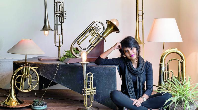 Advaeita Mathur poses with her Vintage Instrument Lamps Project collection. Advaeita Mathur poses with her Vintage Instrument Lamps Project collection.