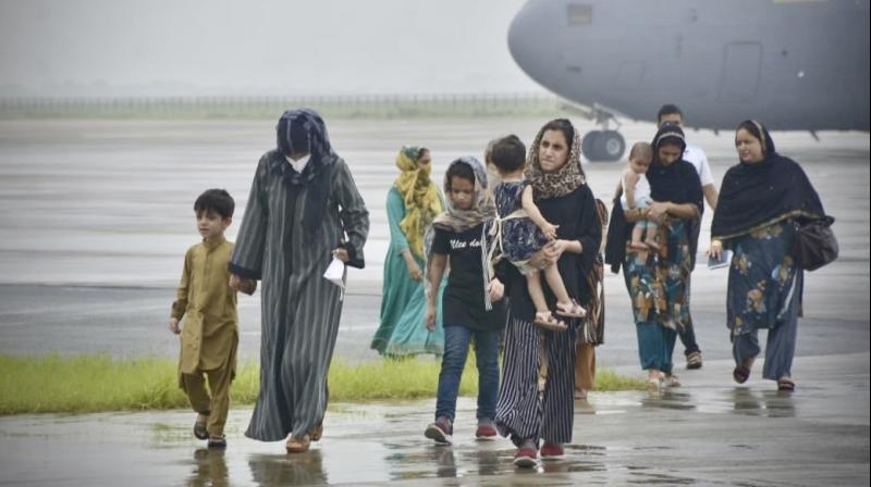 People evacuated from Kabul arrive at Hindon Air force base near New Delhi, India. Sunday, August 22, 2021. A special military flight carrying 168 people, which include 107 Indian nationals and 61 others, landed at Hindon Air force base near New Delhi. (AP)