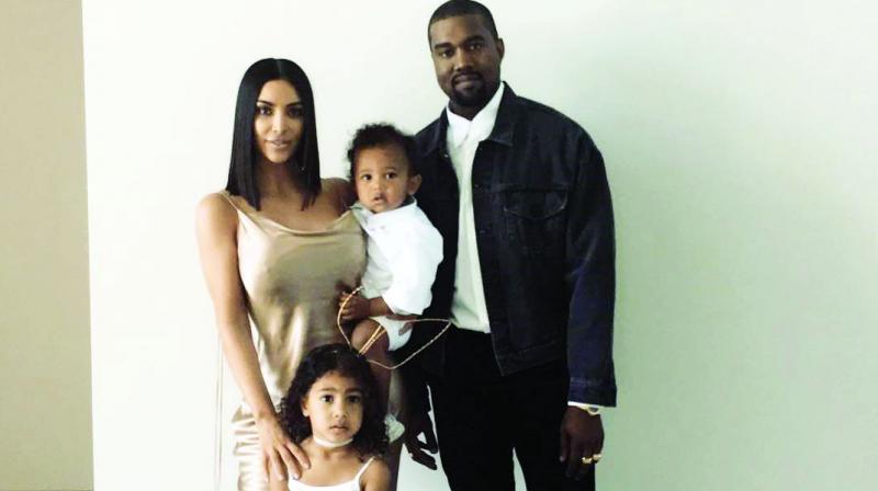 Kim Kardashian and Kanye West with daughter North West and son Saint West Kim Kardashian and Kanye West with daughter North West and son Saint West