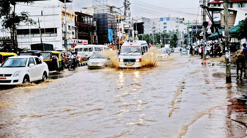 The rain struck during peak hours just when office-goers were returning home. Commuters were stuck in bumper-to-bumper traffic as roads were flooded and trees fell. The rain struck during peak hours just when office-goers were returning home. Commuters were stuck in bumper-to-bumper traffic as roads were flooded and trees fell.