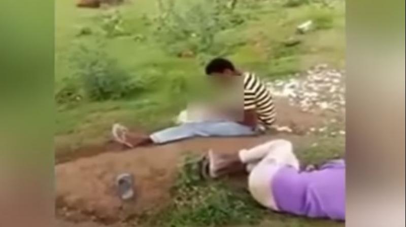 After passing out on the road, the drunk youth woke up hungry and started peeling the feathers of the chicken and eating it alive. (Photo: Youtube screengrab) After passing out on the road, the drunk youth woke up hungry and started peeling the feathers of the chicken and eating it alive. (Photo: Youtube screengrab)
